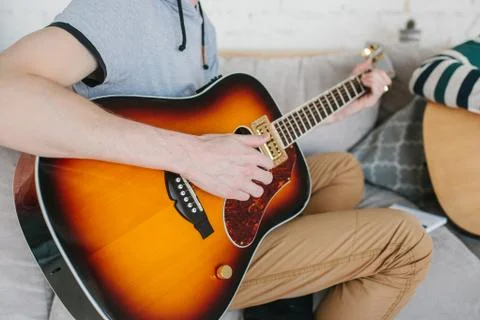 Learning to play the guitar. Stock Photos