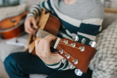 Learning to play the guitar. Stock Photos
