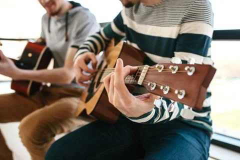 Learning to play the guitar. Stock Photos