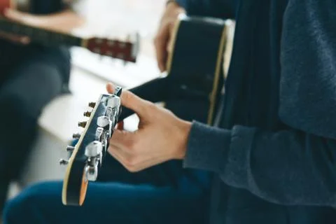 Learning to play the guitar Stock Photos
