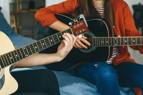 Learning to play the guitar Stock Photos
