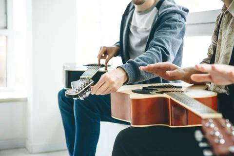 Learning to play the guitar Stock Photos