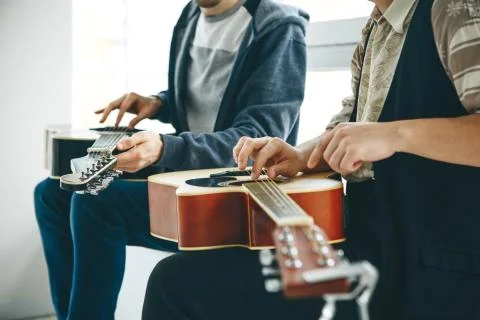 Learning to play the guitar Stock Photos