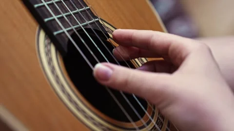 Learning to play guitar strings step by step with hands Stockbeeldmateriaal 332468215