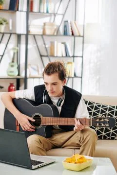 Learning playing guitar Stock Photos