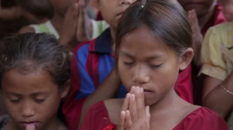 Learning to Pray Stock Footage 40073550