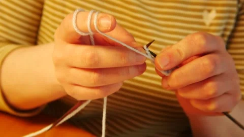 Learning process, roughly coordinate knitting Stock Footage 199785986