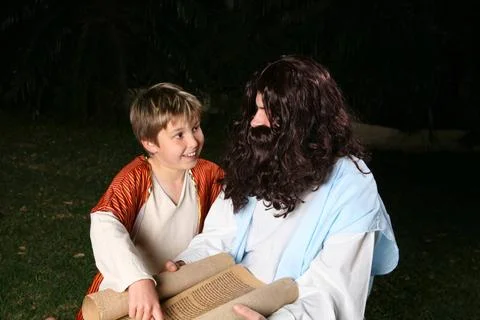 Learning the scriptures A happy child discusses the scriptures with an adu... Stock Photos
