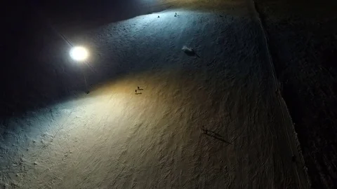 Learning of snowboarder at the night slope. Stock Footage 69938399