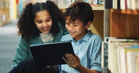 Learning, student and tablet with children in library for back to school Stock Photos