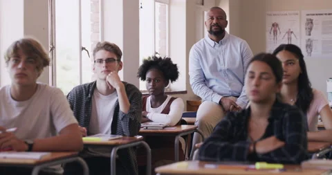 Learning, study and education with a teacher leading a presentation, teaching a Vidéo 205363555