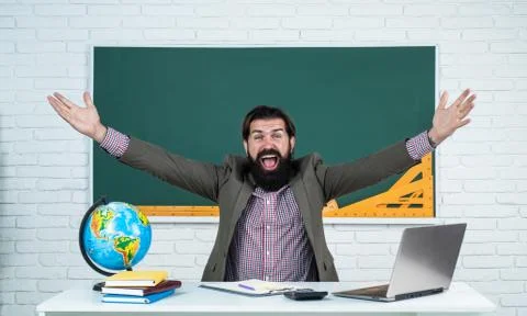 Learning the subject. happy man with beard work on computer. studying online 스톡 사진