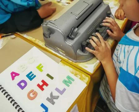 Learning to use the braille typewriter. 写真素材
