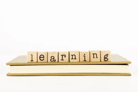 Learning wording stack on a book Stock Photos