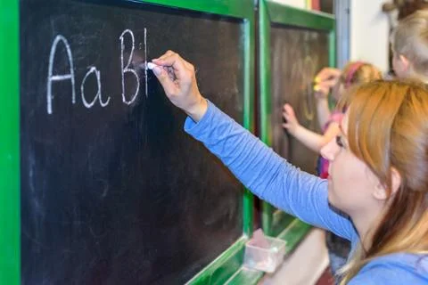 Learning to write ABC on the blackboard Stock Photos