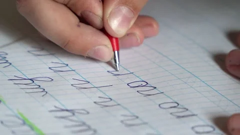 Learning to write in school during back to school time in a classroom Stock Footage 340461648