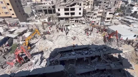 At least 20 killed and 60 missing after bomb-damaged building collapses in Gaza, Stock Footage 345668992
