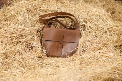 Leather bag in the hay Stock Photos