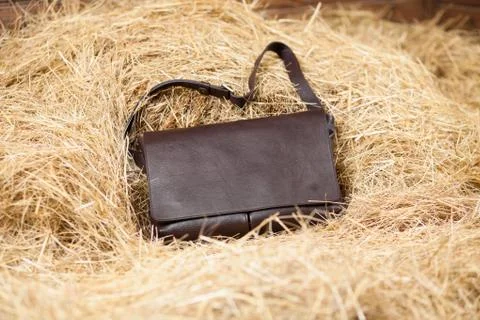 Leather bag in the hay Stock Photos