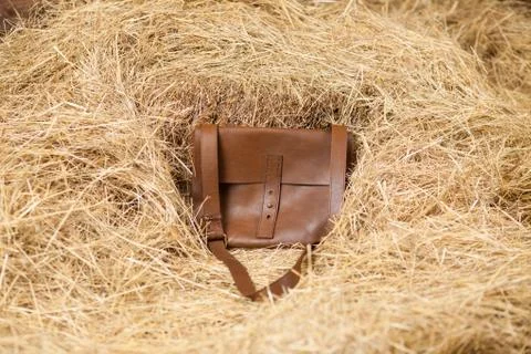 Leather bag in the hay Stock Photos