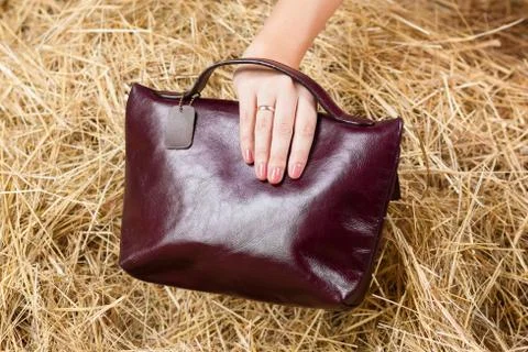 Leather bag in the hay Stock Photos