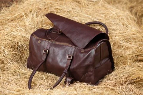 Leather bag in the hay Stock Photos