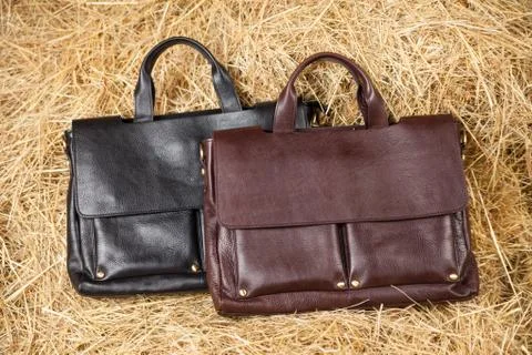 Leather bag in the hay Stock Photos