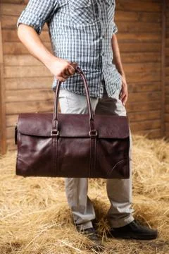 Leather bag in the hay Stock Photos