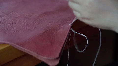 Leather bag sewing by handmade with thread Stock Footage 153346364