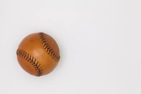 Leather baseball ball on the white table. Stock Photos