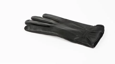 Leather black gloves fall from above on a white background. Stock Footage 168481077
