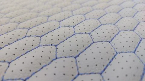 Leather blue stitched with perforated pattern honeycomb black Stock Photos