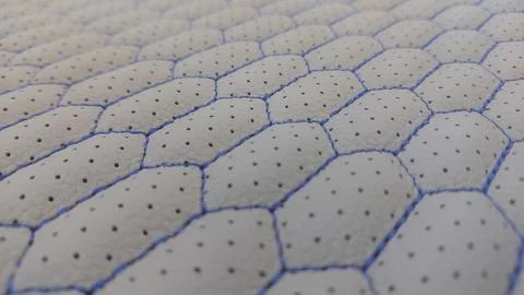 Leather blue stitched with perforated pattern honeycomb Stock Photos