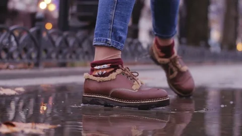 Leather bootst in autumn streets Stock Footage 84993142