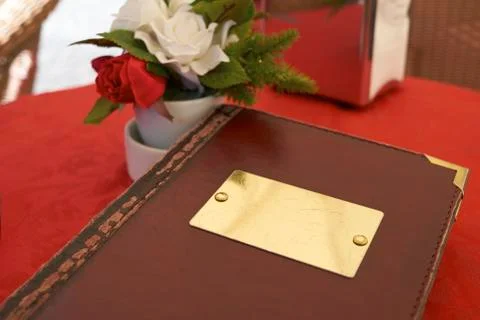 Leather bound menu Stock Photos