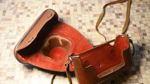 Leather camera case with red suede lining Stock Footage 122625715