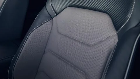Leather car interior. Modern car illuminated dashboard. Luxurious car instrum Stock Photos