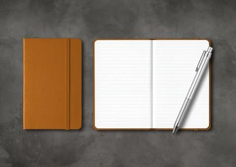 Leather closed and open lined notebooks with a pen on dark concrete backgroun Stock Photos