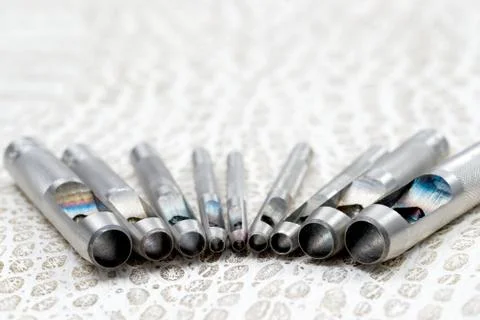 Leather craft tools on a leather background. Craftsman work desk Stock Photos
