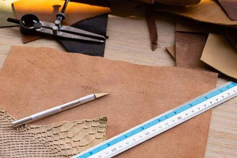 Leather Craft Workshop Flat Lay with Tools Ruler Pencil and Various Leather.. Photos