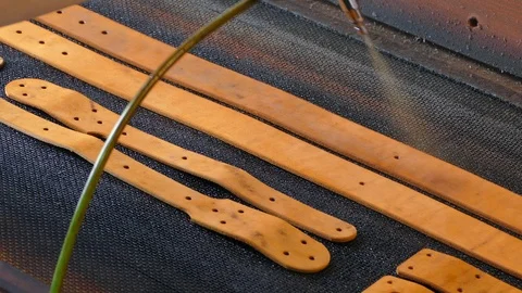 Leather craftsman causes paint on straps. Handmade concept. Concept of small bus Stock Footage 107210037