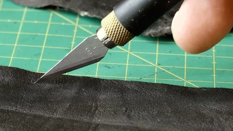 Leather cutting with a knife Stock Footage 79230483
