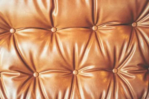 Leather gold color pattern texture background, vintage filter image Photos
