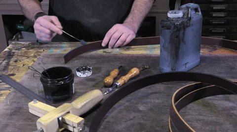 Leather goods craftsman at work in his workshop Stock Footage 59106304