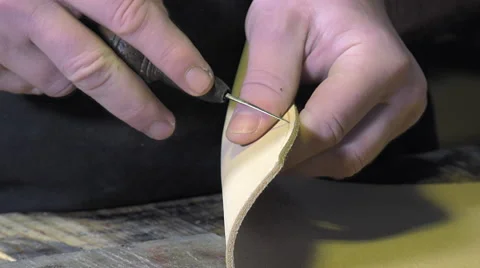 Leather goods craftsman at work in his workshop Stock-Footage 59107525