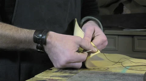 Leather goods craftsman at work in his workshop Stock-Footage 59108240