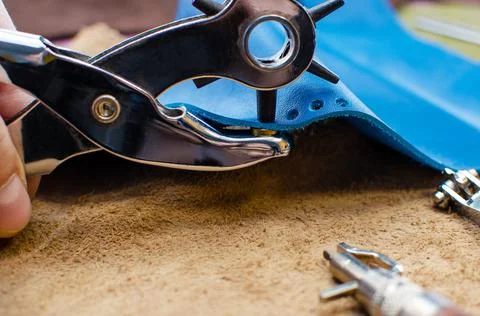 Leather goods manufacturing process. Tools for sewing bags, wallets, clutches Stock Photos