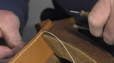 Leather goods master craftsman at work Video stock 61160537