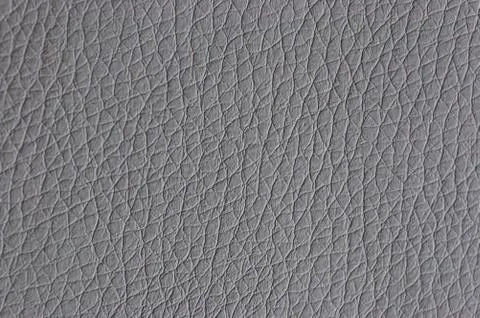 Leather gray background. background with artificial gray leather. Gray textur Stock Photos
