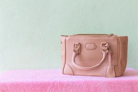 Leather handbag on the table Stock Photos